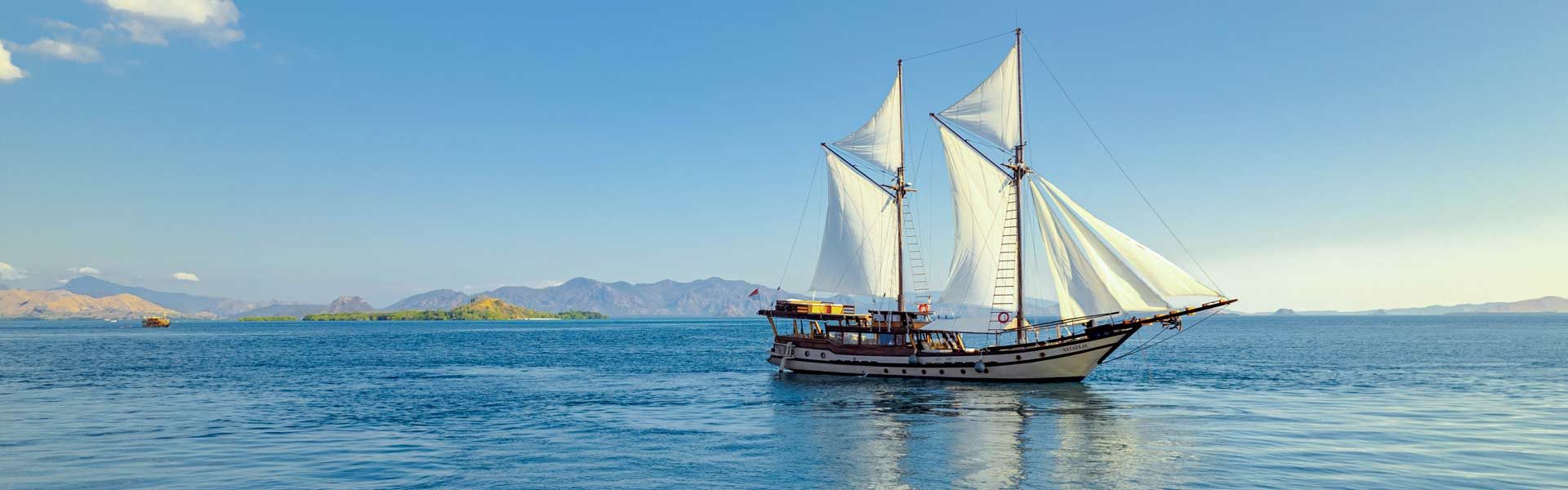View from the Padar Island ridge over three curved bays in Komodo National Park