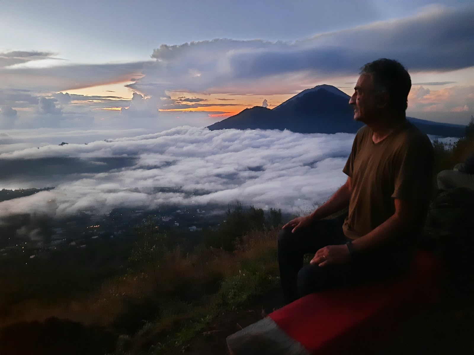 Golden sunrise colors illuminating the caldera of Mount Batur